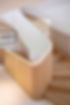 Curved timber staircase with a solid balustrade and vertical slats